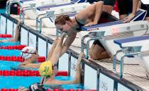 Bronte and Cate Campbell celebrate winning gold and setting a new world record in the final of the Women's 4 x 100m Freestyle Relay on Day 1 of the Rio 2016 Olympic Games. Photo: Getty