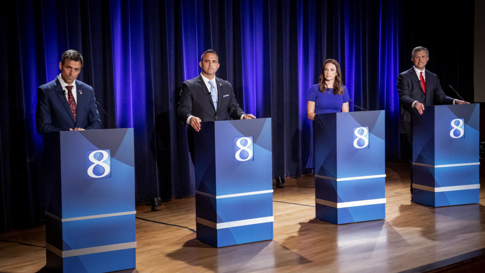 Michigan Republican candidates for governor Ryan Kelley, of Allendale, from left, Garrett Soldano, of Mattawan, Tudor Dixon, of Norton Shores and Kevin Rinke, of Bloomfield Township, appear at a debate in Grand Rapids, Mich., Wednesday, July 6, 2022. (Michael Buck/WOOD TV8 via AP)