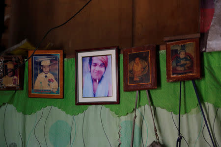 Pictures of the late Bernabe Sabangan, when he was a teenager and a baby, are seen on display at his family's house in Barangay Bagong Silangan in Quezon City, Metro Manila, Philippines November 28, 2017. REUTERS/Erik De Castro NO RESALES. NO ARCHIVES