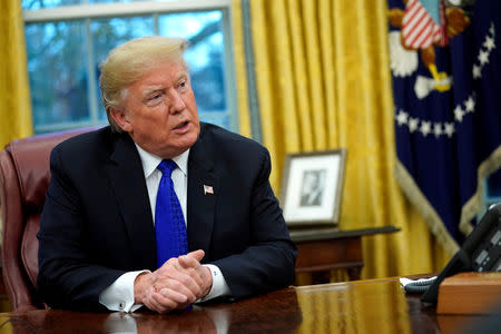 FILE PHOTO: U.S. President Donald Trump sits for an exclusive interview with Reuters journalists in the Oval Office at the White House in Washington, U.S. December 11, 2018. REUTERS/Jonathan Ernst/File Photo