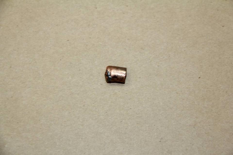 A bullet fragment recovered as evidence for the investigation into an April 2021 police shooting involving a Doral detective.