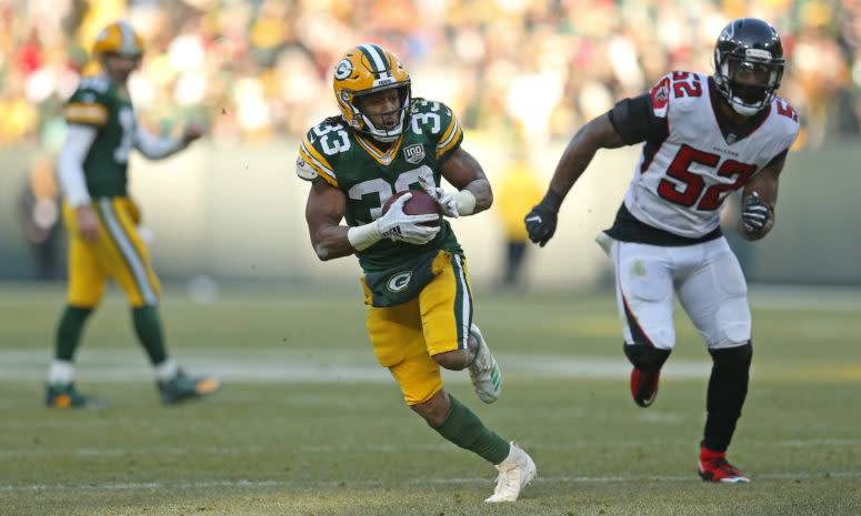 Aaron Jones running with the football for the Green Bay Packers against the Falcons.