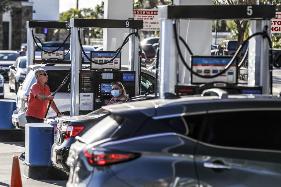 People pump gas.