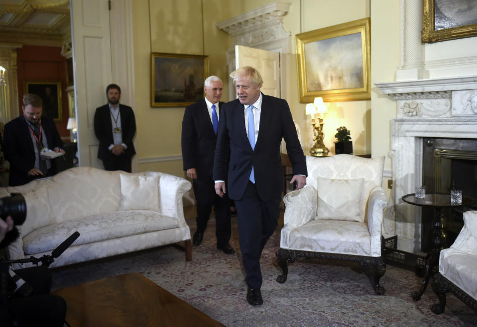 Britain's Prime Minister Boris Johnson, front, meets with US Vice President Mike Pence inside 10 Downing Street in London, Thursday, Sept. 5, 2019. (Peter Summers/Pool photos via AP)