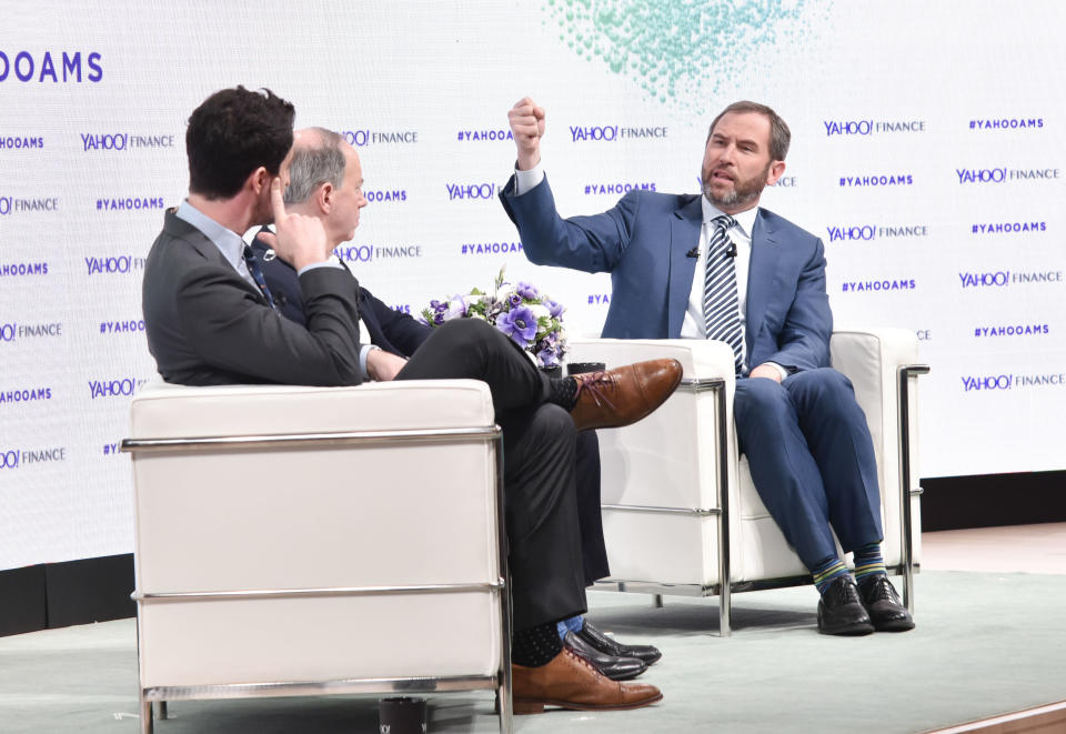 NEW YORK, NY - FEBRUARY 07:  Dan Roberts, Brad Garlinghouse, and Andy Serwer attend the Yahoo Finance All Markets Summit: Crypto on February 7, 2018 in New York City.  (Photo by Eugene Gologursky/Getty Images for Yahoo Finance/Oath )