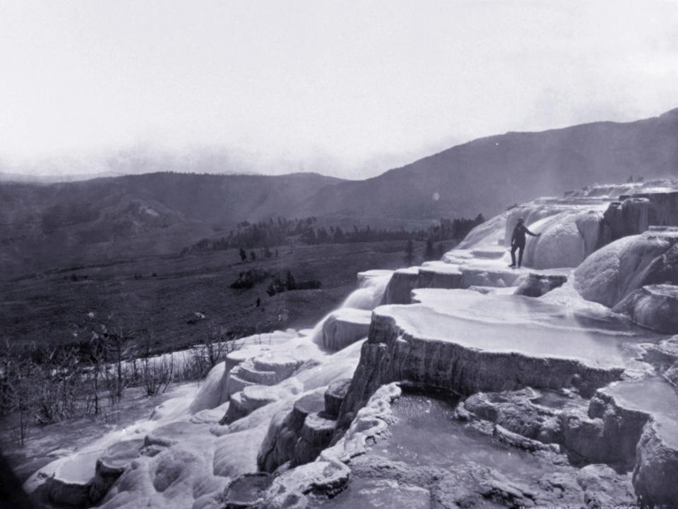 Park Superintendent Nathaniel Pitt Langford stands on Jupiter Terrace, Mammoth Hot Springs, Yellowstone National Park, Wyoming, in 1872.