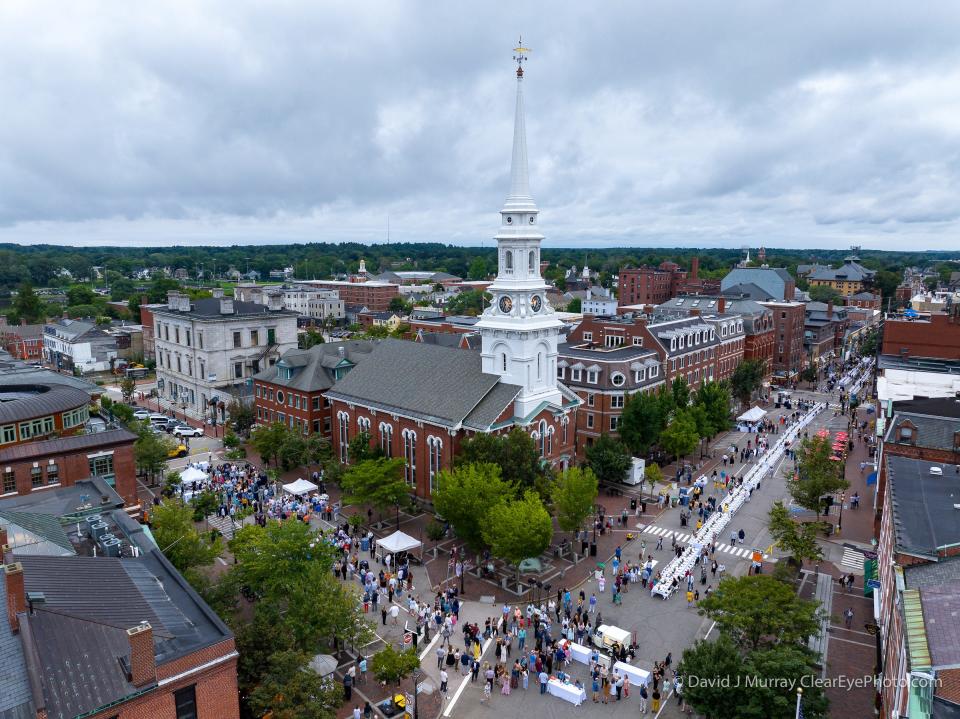 Tables line Congress Street for the Portsmouth 400th anniversary lobster dinner Wednesday, Aug. 16, 2023.