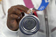 Simone Biles, of the United States, holds the silver medal after the gymnastics artistic women's team final at the 2020 Summer Olympics, Tuesday, July 27, 2021, in Tokyo. (AP Photo/Natacha Pisarenko)
