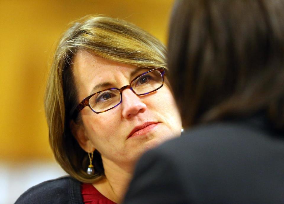 Stacey Kalberman (left), former executive director of the state ethics commission, confers with one of her legal representatives Mary Davis while testifying in her whistle-blower lawsuit at the Fulton County Courthouse on Thursday, April 3, 2014, in Atlanta. Kalberman claims she was forced from her position as executive director of the state ethics commission after investigating Governor Nathan Deal's campaign. (AP Photo/Atlanta Journal-Constitution, Curtis Compton) MARIETTA DAILY OUT; GWINNETT DAILY POST OUT; LOCAL TV OUT; WXIA-TV OUT; WGCL-TV OUT