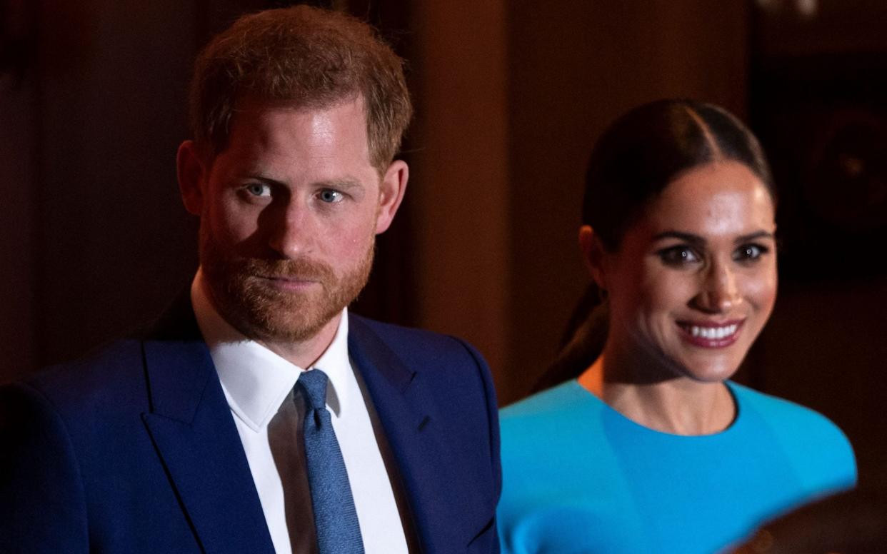 Prince Harry, Duke of Sussex (L), and Meghan, Duchess of Sussex - Justin Tallis/AFP