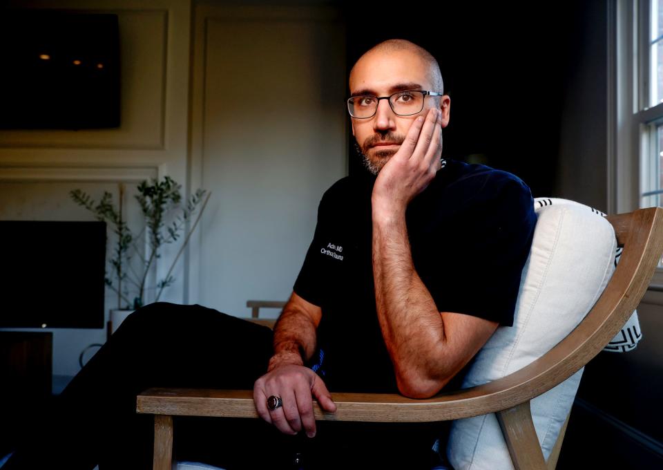 Dr. Adam Fahs at his home in Bloomfield Hills on Tuesday, Feb. 20, 2024. Fahs recently spent six days in southern Gaza through Rahma Worldwide, a humanitarian aid organization, where he, along with other doctors, operated on injured people at the European Gaza and Nasser Hospital.