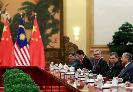 Malaysia's Prime Minister Mahathir Mohamad speaks to China's Premier Li Keqiang (not pictured) during their meeting at the Great Hall of the People in Beijing, China, August 20, 2018. How Hwee Young/Pool via REUTERS