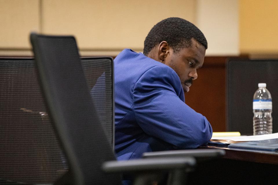De'Arius Cannon waits for his attorneys, the prosecution team and judge to finish their sidebar so his trial can continue Wednesday, Nov. 30, 2022. Canon is facing charges of second-degree murder, attempted murder and weapons charges in connection with the Oct. 29 shooting. 