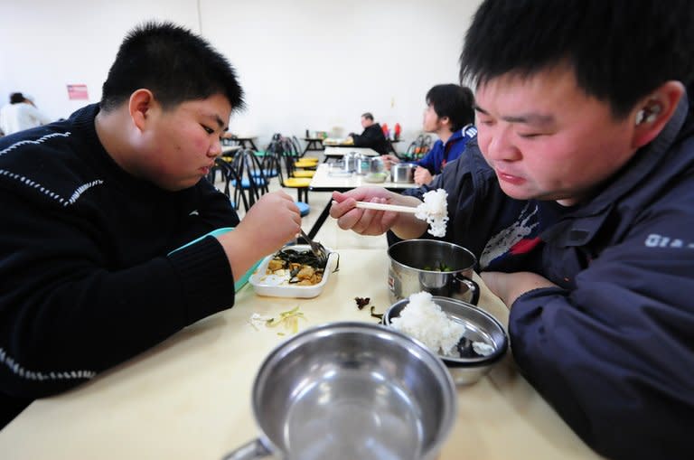 This file photo, taken on November 18, 2008, shows patients eating their lunch at a weight reduction clinic in Tianjin in northern China. There are an estimated 347 million diabetes sufferers worldwide and diagnoses are increasing, particularly in developing countries, due to growing levels of obesity and physical inactivity