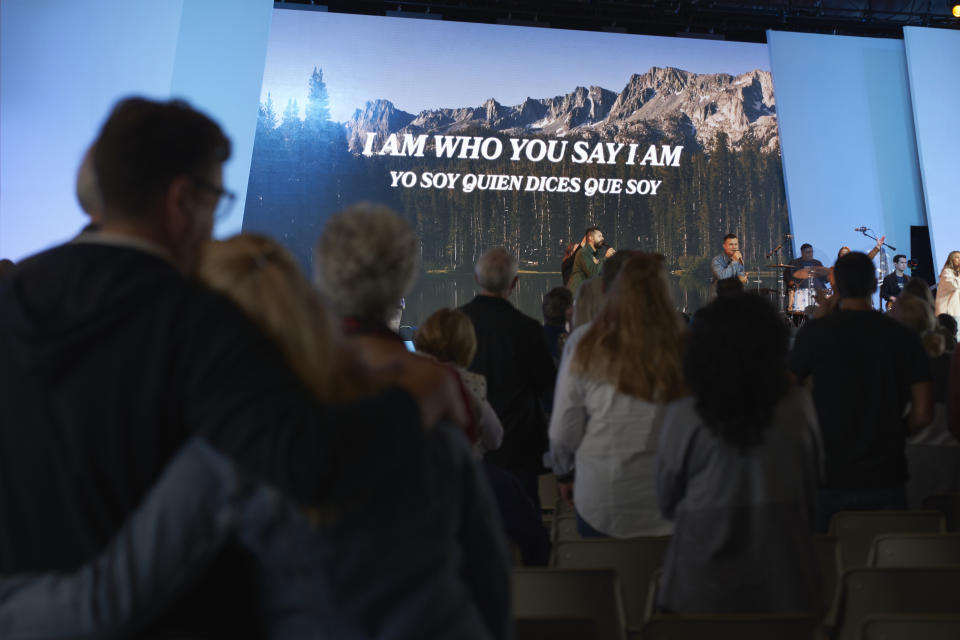 Congregants watch the church band perform before Pastor Andy Wood gives his sermon on Sunday, Oct. 16, 2022, at Saddleback Church in Lake Forest, Calif. Wood was recently announced as founding Pastor Rick Warren's successor to the church, which is the second largest in the Southern Baptist Convention, regularly drawing in about 2,500 people with more online every Sunday. (AP Photo/Allison Dinner)