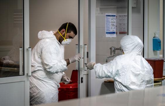 Doctors in the ICU of the coronavirus section of the hospital