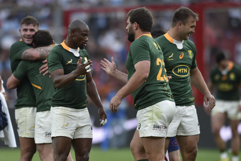 South Africa's Makazole Mapimpi, left, celebrates with teammate Frans Steyn, after winning a rugby championship match against Argentina's Los Pumas, in Buenos Aires, Argentina, Saturday, Sept. 17, 2022. (AP Photo/Gustavo Garello)