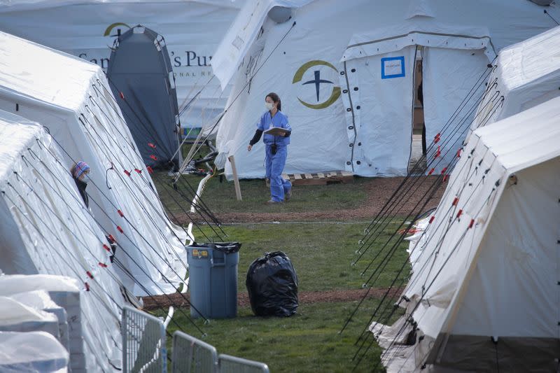Healthcare worker outside newly constructed field hospital in East Meadow of Central Park during outbreak of coronavirus disease (COVID-19) in New York