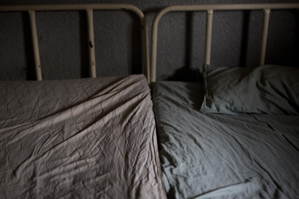 This Tuesday, Aug. 14, 2018 photo shows hospital beds at the Masaidiano Health Center in Lubumbashi, Democratic Republic of the Congo. An Associated Press investigation found that of more than 20 hospitals and clinics visited in Lubumbashi, all but one detain patients, an illegal practice according to the Congolese penal code. Many hospitals lack running water and regular electricity and bed shortages are often so severe that two patients must squeeze onto a single mattress. (AP Photo/Jerome Delay)