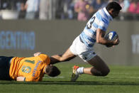 Argentina's Lucio Cinti, right, is tackled by Australia's Nick Frost, during their Rugby Championship match at the Bicentenario stadium in San Juan, Argentina, Saturday, Aug. 13, 2022. (AP Photo/Natacha Pisarenko)