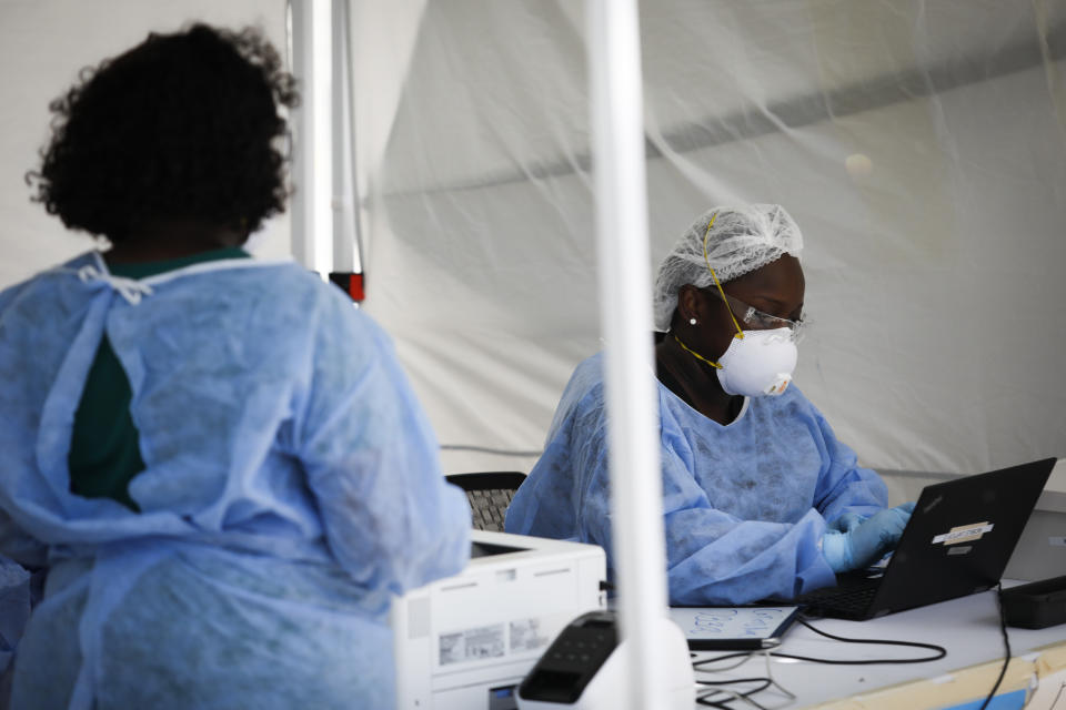 FLORIDA, USA - JULY 24: A healthcare worker collects works on a computer at a mobile COVID-19 testing facility, in Miami Beach, Florida, United States on July 24, 2020. (Photo by MARCO BELLO/Anadolu Agency via Getty Images)