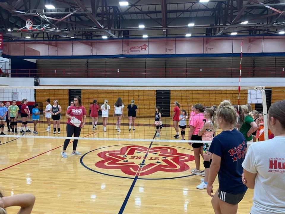 New BNL volleyball head coach Whitney Carroll (middle) addresses campers this week at her first BNL Stars Volleyball Camp.
