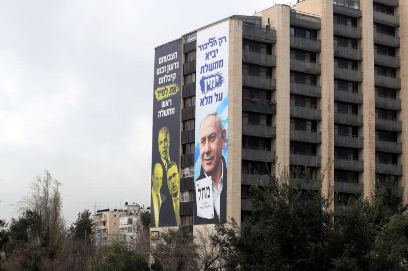 Election campaign posters by Israeli prime minister Benjamin Netanyahu's Likud Party are seen on a building in Jerusalem