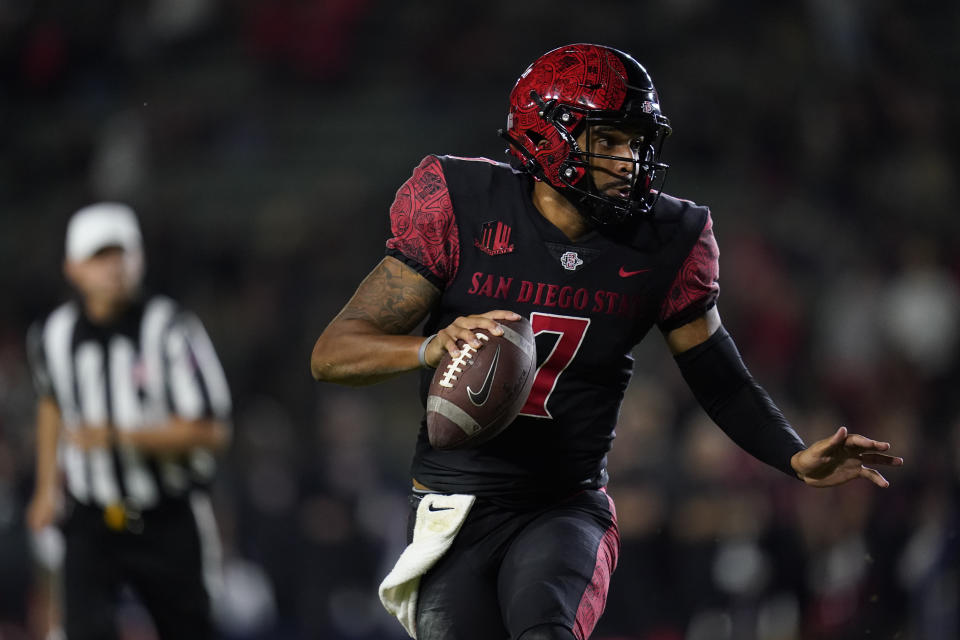 San Diego State quarterback Lucas Johnson (7) runs the ball during overtime of an NCAA college football game against Utah Saturday, Sept. 18, 2021, in Carson, Calif. (AP Photo/Ashley Landis)