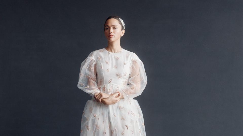 a barefoot bride in a white simone rocha tea length gown