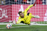 New England Revolution goalkeeper Matt Turner dives for but can't make the save on a penalty kick, after regulation and extra time, in an MLS playoff soccer match against New York City FC, Tuesday, Nov. 30, 2021, in Foxborough, Mass. New York City won 3-2. (AP Photo/Charles Krupa)