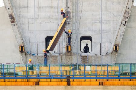 Workers are seen at the bridge construction site of the Bar-Boljare highway in Bioce, Montenegro June 11, 2018. Picture taken June 11, 2018. REUTERS/Stevo Vasiljevic