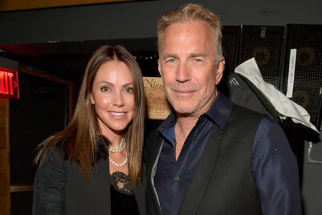 <p>Lester Cohen/Getty </p> Kevin Costner (right) with ex-wife Christine Costner in April 2022