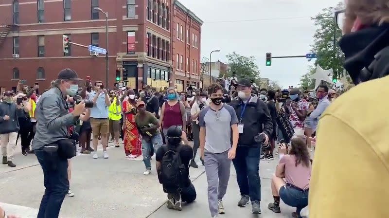 Social media video grab of Minneapolis Mayor Jacob Frey walking from a crowd of protesters, in the aftermath of the death in Minneapolis police custody of George Floyd