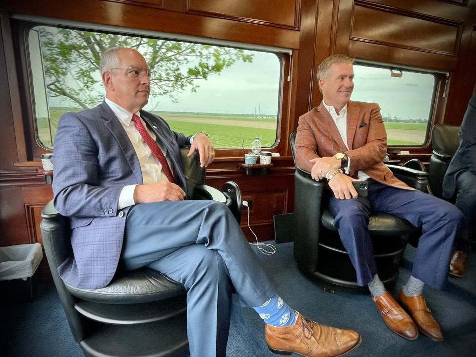 Louisiana Gov. John Bel Edwards, left, and Canadian Pacific President Keith Creel inspect the rail on a trip between Baton Rouge and New Orleans on April 20, 2022.