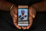 The Wider Image: Indians share the stories of loved ones they lost to the pandemic