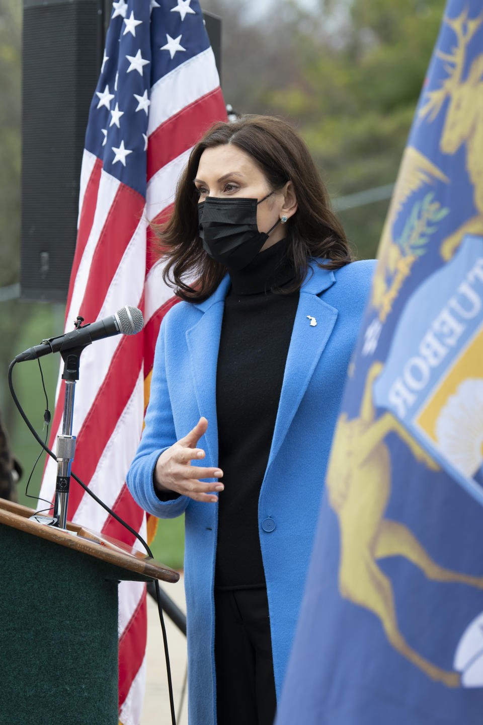 Michigan Governor Gretchen Whitmer U.S. talks about the statewide COVID-19 vaccination effort during a press conference outside the Eastern Michigan University Convocation Center, which was hosting a vaccination clinic, Monday, April 12, 2021. (Lon Horwedel/Detroit News via AP)