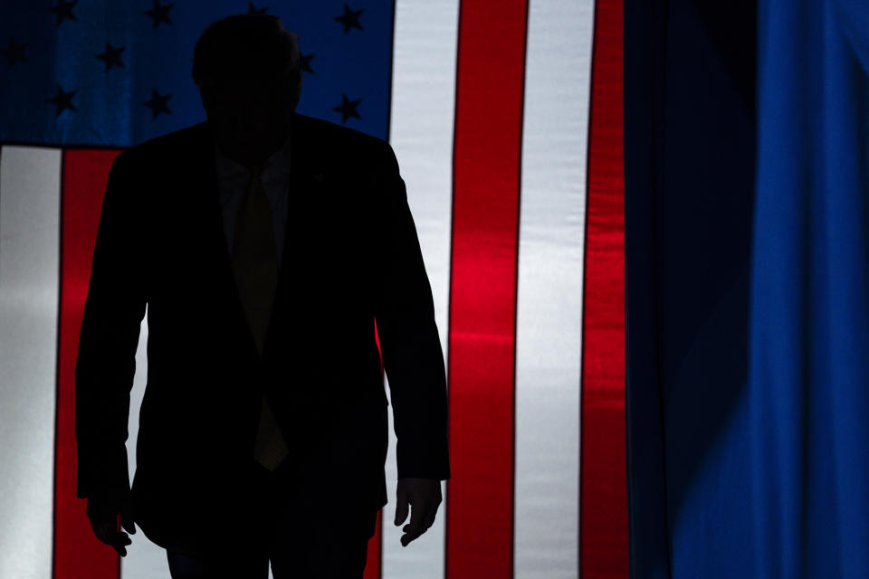 FILE - In this Feb. 20, 2020, file photo President Donald Trump arrives to speak at a campaign rally at The Broadmoor World Arena in Colorado Springs, Colo. As the economy faces a once-in-a-century recession, with more than 38 million people out of work, Trump is increasingly talking up a future recovery that probably won't materialize until after the November election. (AP Photo/Evan Vucci, File)