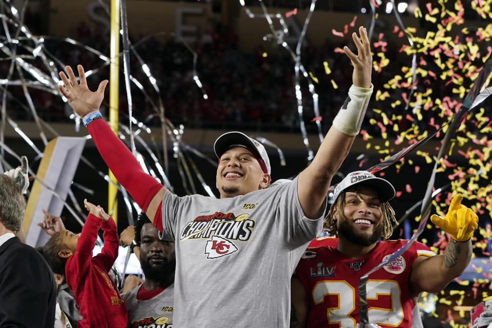 FILE - In this Feb. 2, 2020, file photo, Kansas City Chiefs' Patrick Mahomes, left, and Tyrann Mathieu celebrate after defeating the San Francisco 49ers in the NFL Super Bowl 54 football game in Miami Gardens, Fla. The Kansas City Chiefs began talking about a repeat before they had even left the stadium following their Super Bowl triumph. (AP Photo/David J. Phillip, File)