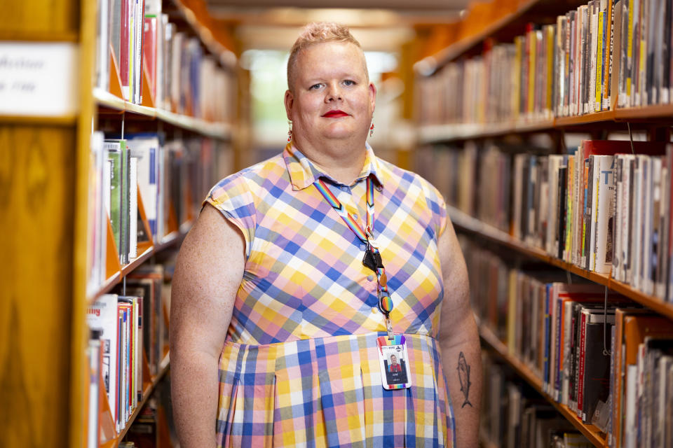 June Meissner poses for a photo at the Boise Public Library in Boise, Idaho on Thursday, June 6, 2024. Meissner, a transgender woman and librarian, blocked a punch from a man yelling slurs while working at the library. (AP Photo/Kyle Green)