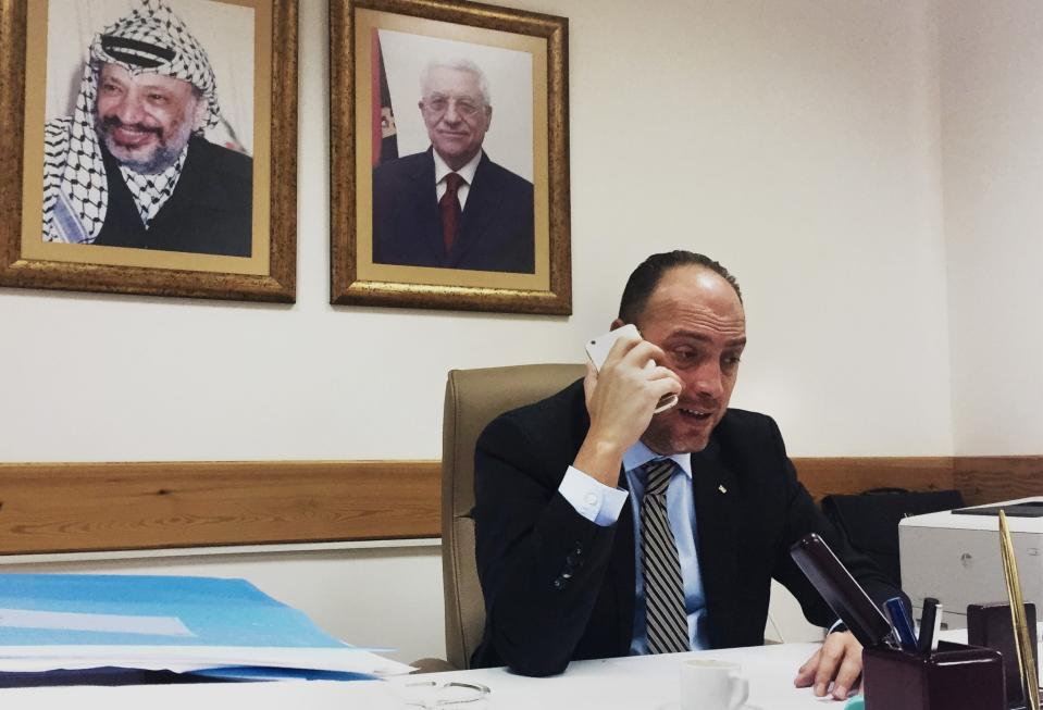 Dr. Husam Zomlot, senior adviser to Palestinian President Mahmoud Abbas, speaks on the phone, saying that he hopes the United States will not move its embassy to Jerusalem and undercut peace talks. (Photo: Ash Gallagher for Yahoo News)