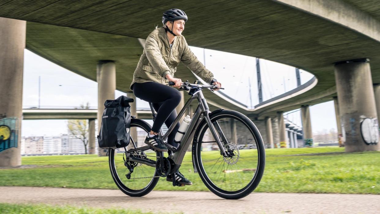  Woman riding Orbea Diem e-bike . 