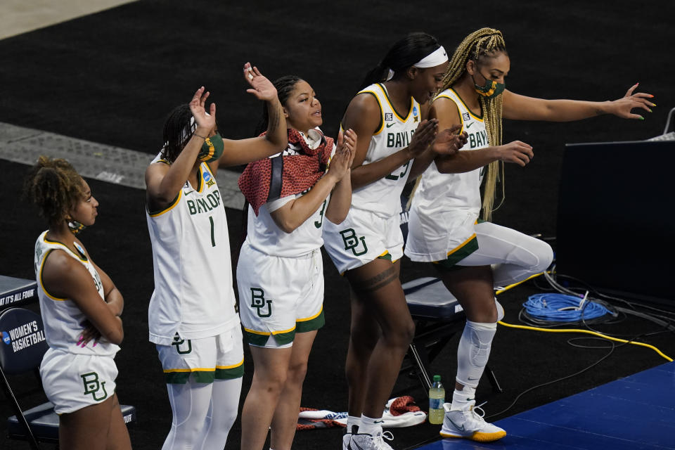 Baylor players celebrate on the bench during the second half of a college basketball game against Jackson State in the first round of the women's NCAA tournament at the Alamodome, Sunday, March 21, 2021, in San Antonio. Baylor won 101-52. (AP Photo/Eric Gay)