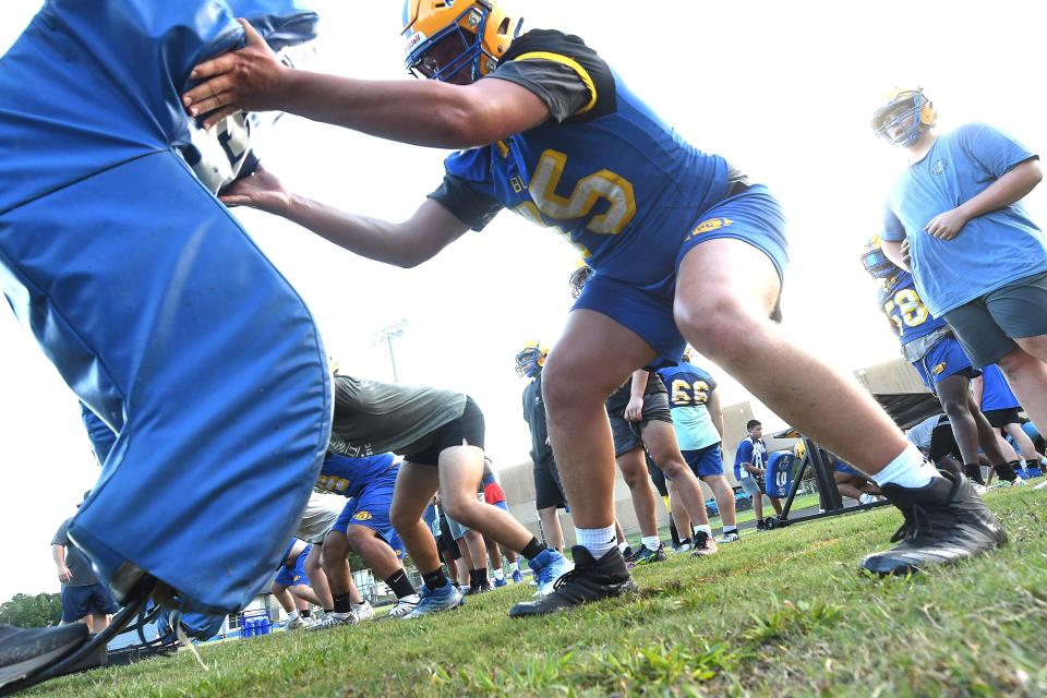 Laney runs through football practice drills Monday July 31, 2023 in Wilmington, N.C. High School football started Monday with coaches and players hitting the practice fields across the area. (KEN BLEVINS/STARNEWS)