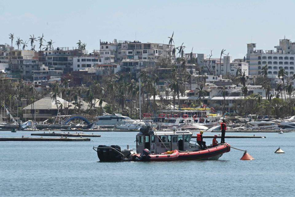 Members of the Secretary of the Navy carry out search and rescue activities to find missing persons reported after the passage of Hurricane Otis in the nautical area of Acapulco, Guerrero state, Mexico on October 30, 2023. Three foreigners were among at least 45 people killed when Hurricane Otis lashed Acapulco last week, authorities said Monday, as Mexico's president promised to put the devastated beachside city "back on its feet." The foreign victims -- from the United States, Britain and Canada -- were residents of Acapulco, Evelyn Salgado, governor of the southern state of Guerrero, told reporters.