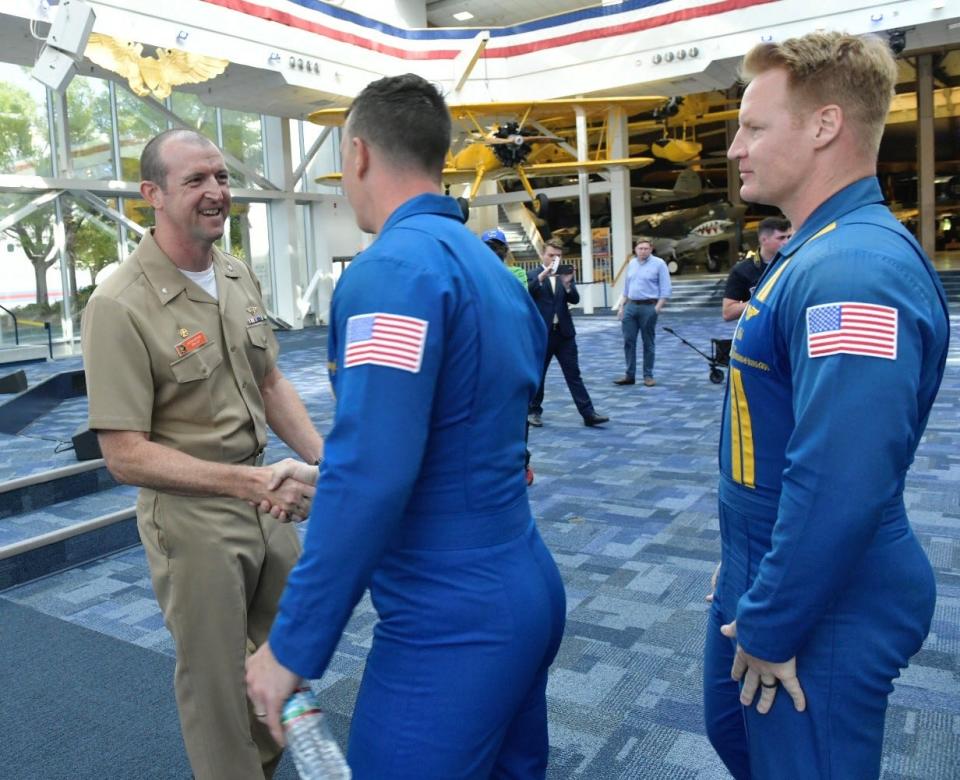 Cmdr. Adam Bryan, the newly selected commanding officer for the Blue Angels, greets members of the team on Tuesday, April 16, 2024.