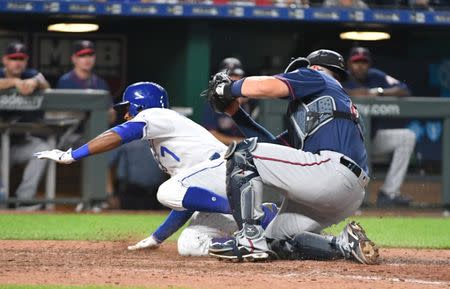 Jul 21, 2018; Kansas City, MO, USA; Kansas City Royals shortstop Rosell Herrera (7) is tagged out at the plate by Minnesota Twins catcher Bobby Wilson (46) in the eighth inning at Kauffman Stadium. The Royals won 4-2. Mandatory Credit: Denny Medley-USA TODAY Sports