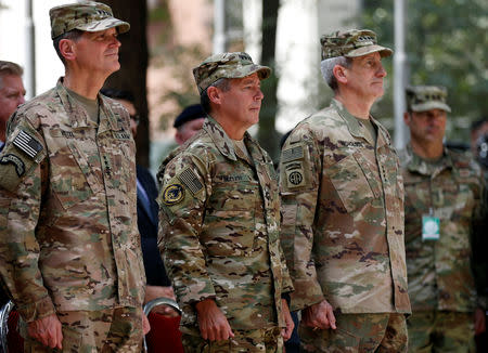 Incoming Commander of Resolute Support forces and command of NATO forces in Afghanistan, U.S. Army General Scott Miller (C) stands during a change of command ceremony in Resolute Support headquarters in Kabul, Afghanistan September 2, 2018.REUTERS/Mohammad Ismail