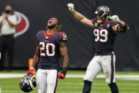 Houston Texans strong safety Justin Reid (20) and defensive end J.J. Watt (99) celebrate their win over the New England Patriots in an NFL football game, Sunday, Nov. 22, 2020, in Houston. (AP Photo/David J. Phillip)