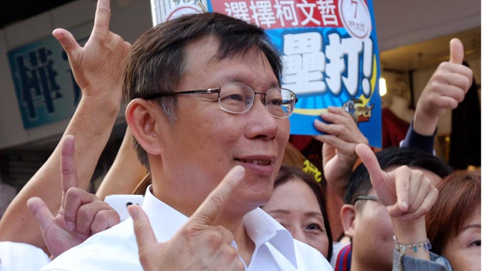 To go with Taiwan-politics-vote-mayor,FOCUS by Amber Wang In this picture taken on November 25, 2014, Ko Wen-je, an independent Taipei mayor candidate, gestures during campaigning in Taipei.