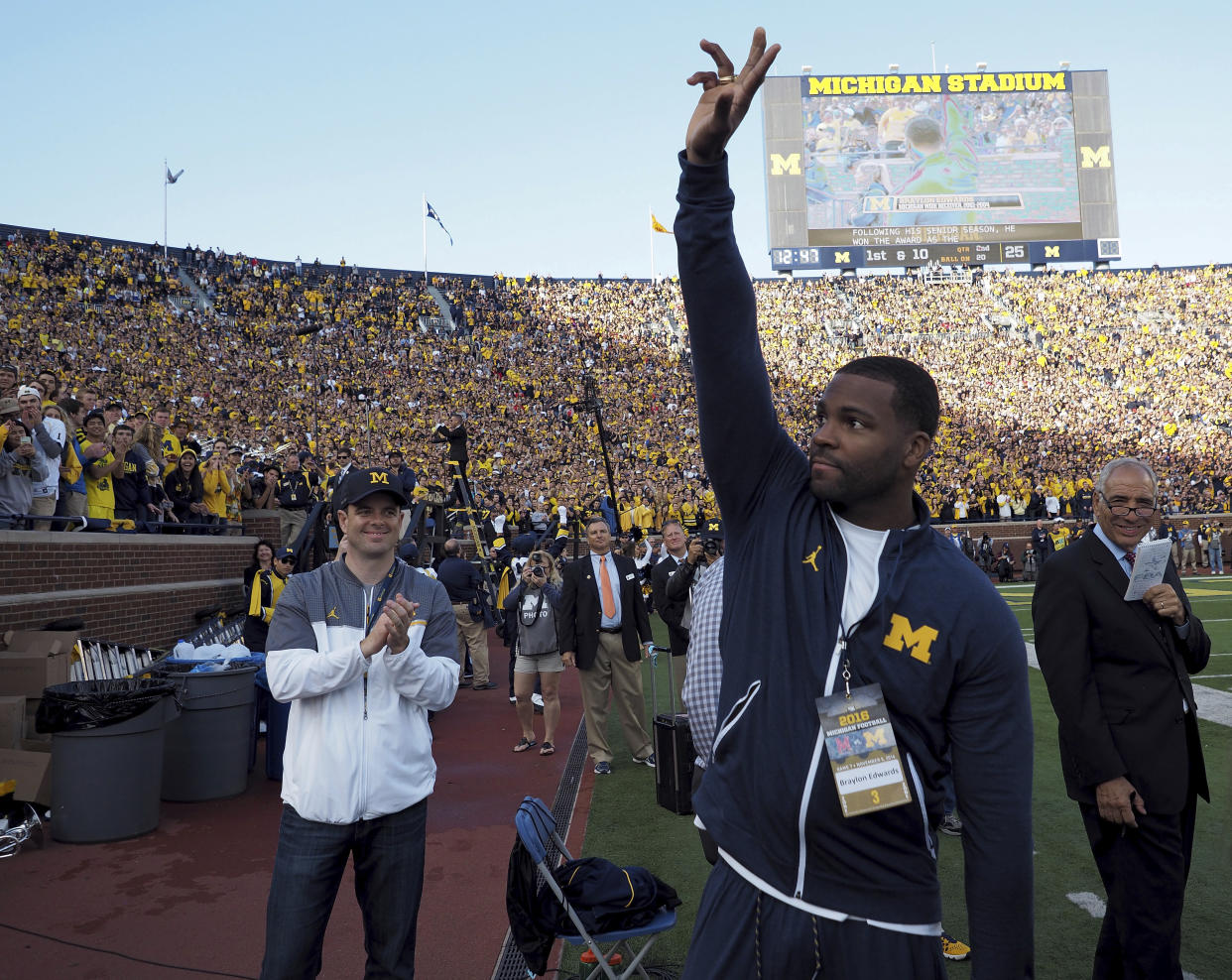 Former Michigan wide receiver Braylon Edwards is recognized by the stadium announcer to the crowd in the second quarter of an NCAA college football game against Maryland in Ann Arbor, Mich., Saturday, Nov. 5, 2016. (AP Photo/Tony Ding)